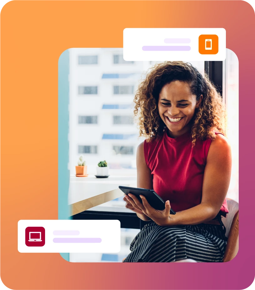 Lady smiling while sat using a tablet device